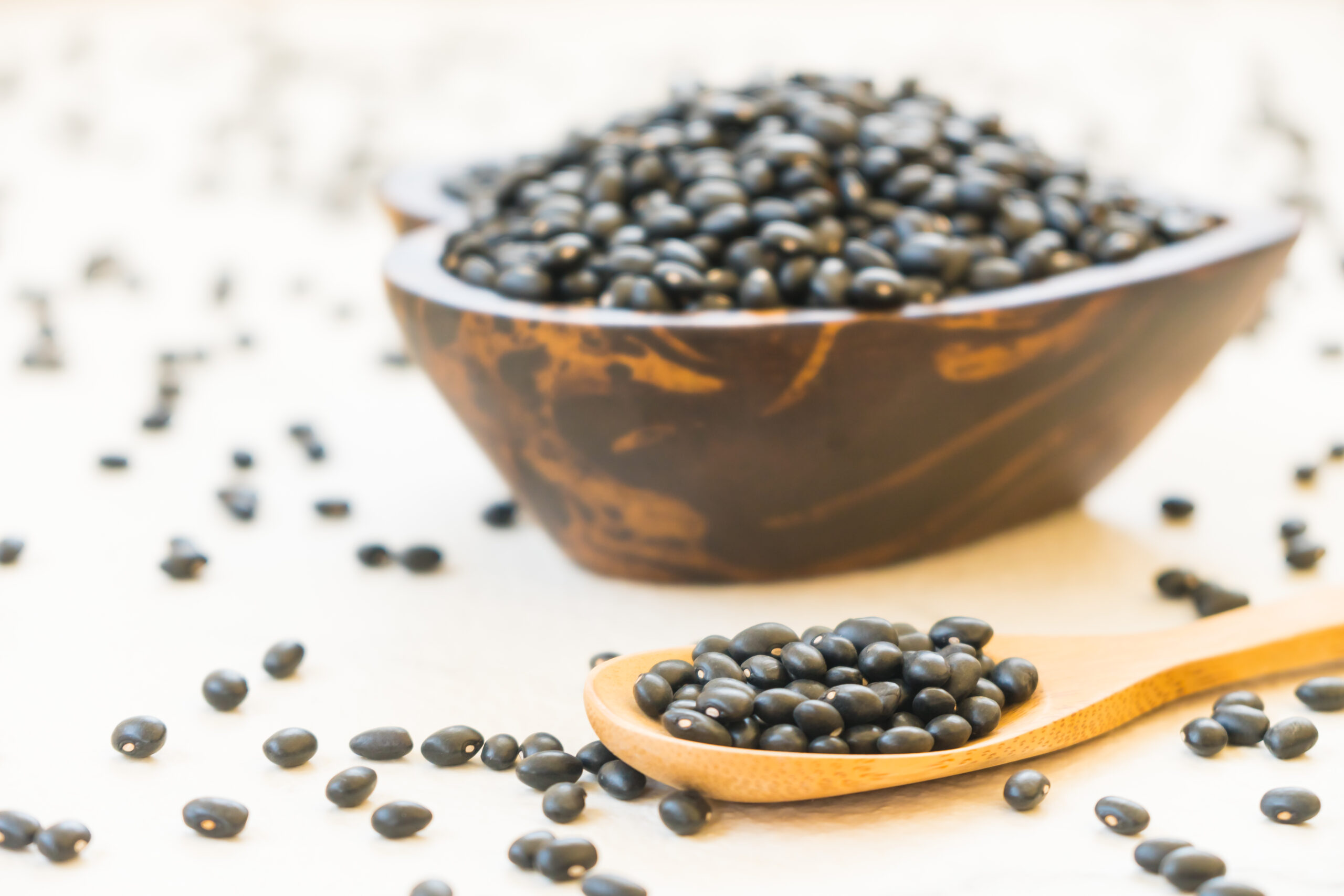 Black beans in wooden bowl - Healthy and Nutrition food concept